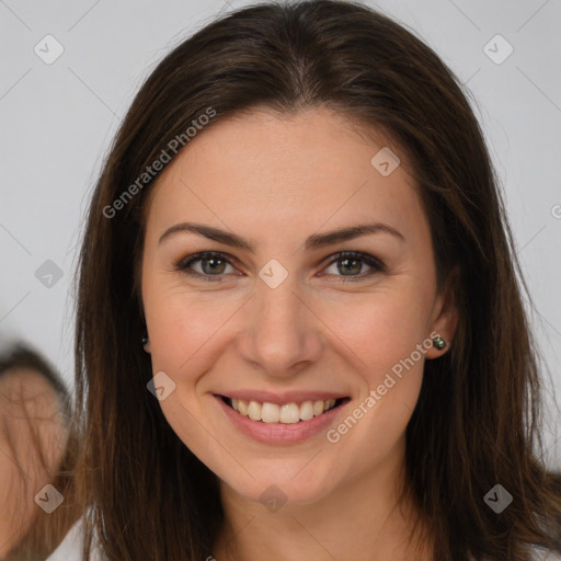 Joyful white young-adult female with long  brown hair and brown eyes