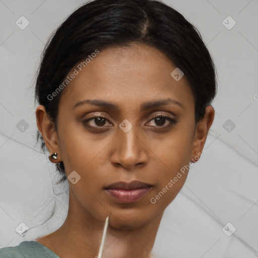 Neutral black young-adult female with medium  brown hair and brown eyes