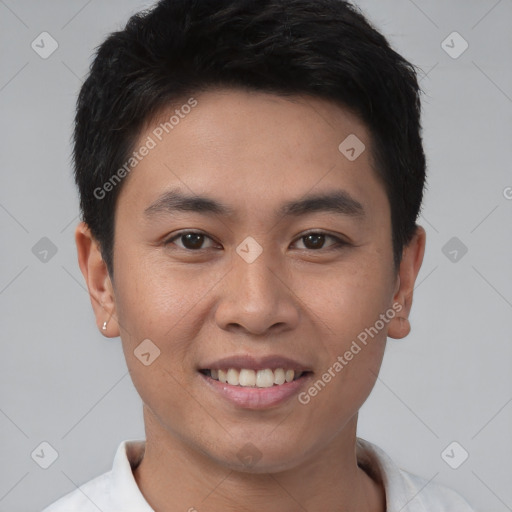Joyful asian young-adult male with short  brown hair and brown eyes