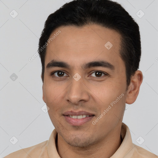 Joyful latino young-adult male with short  black hair and brown eyes