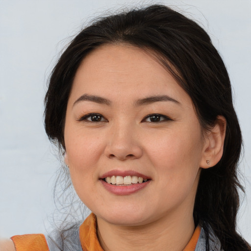Joyful asian young-adult female with medium  brown hair and brown eyes