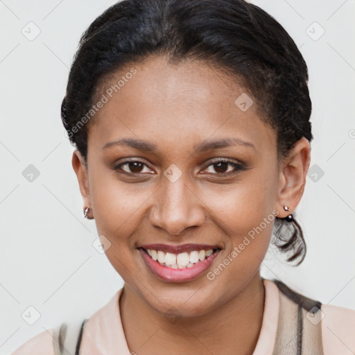 Joyful latino young-adult female with short  brown hair and brown eyes