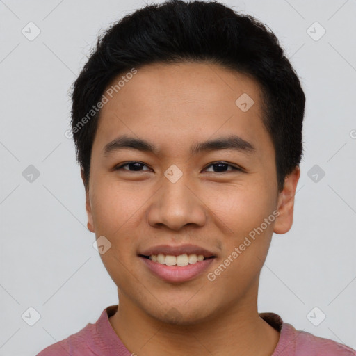 Joyful asian young-adult male with short  black hair and brown eyes