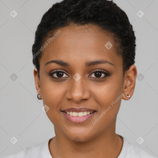 Joyful black young-adult female with short  black hair and brown eyes