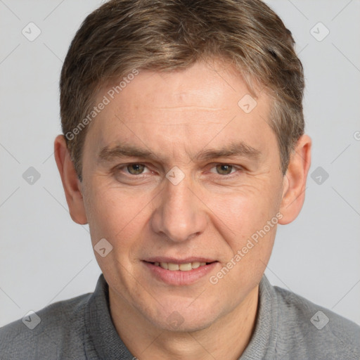 Joyful white adult male with short  brown hair and grey eyes