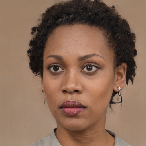 Neutral black young-adult female with short  brown hair and brown eyes