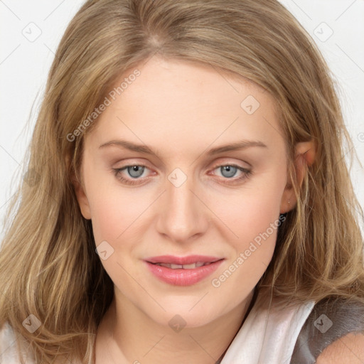 Joyful white young-adult female with long  brown hair and blue eyes