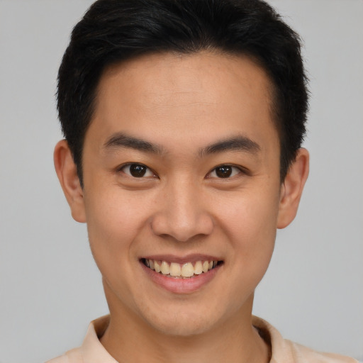 Joyful latino young-adult male with short  brown hair and brown eyes