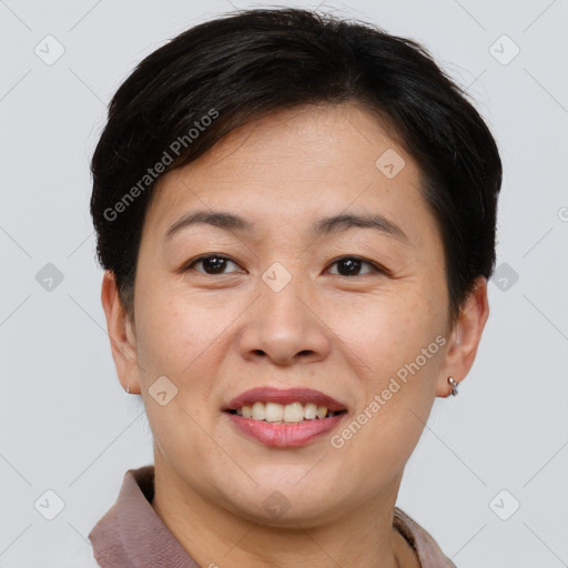 Joyful asian young-adult female with short  brown hair and brown eyes