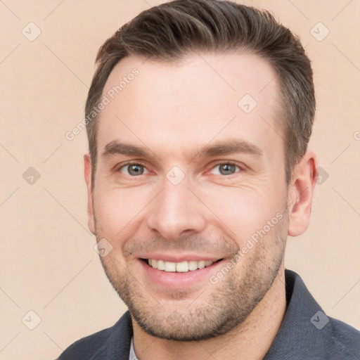 Joyful white young-adult male with short  brown hair and brown eyes