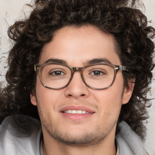 Joyful white young-adult male with medium  brown hair and brown eyes