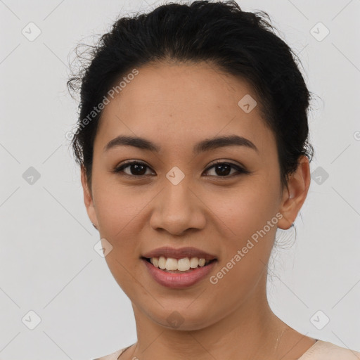 Joyful latino young-adult female with short  brown hair and brown eyes