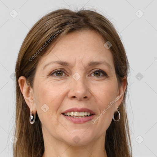 Joyful white adult female with long  brown hair and grey eyes