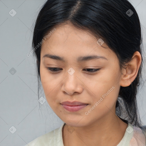 Joyful asian young-adult female with medium  brown hair and brown eyes