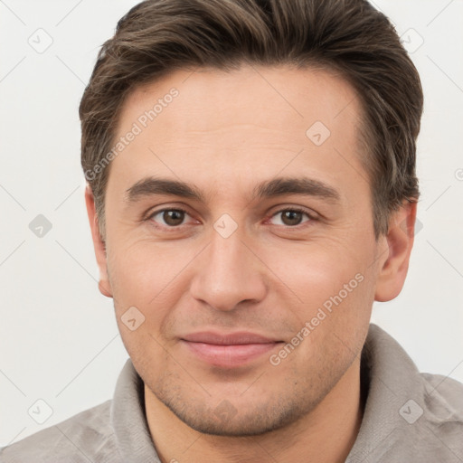 Joyful white young-adult male with short  brown hair and brown eyes