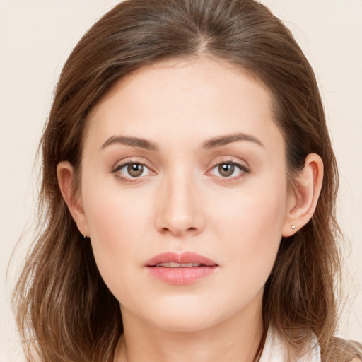 Neutral white young-adult female with long  brown hair and brown eyes