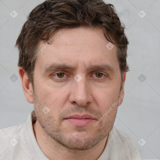 Joyful white adult male with short  brown hair and grey eyes