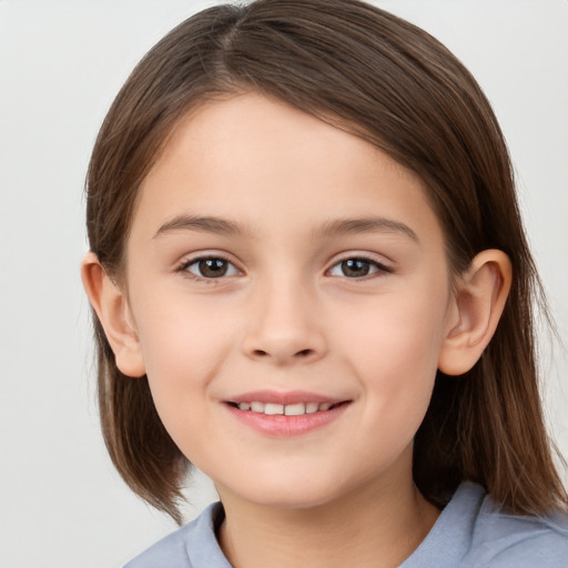 Joyful white child female with medium  brown hair and brown eyes