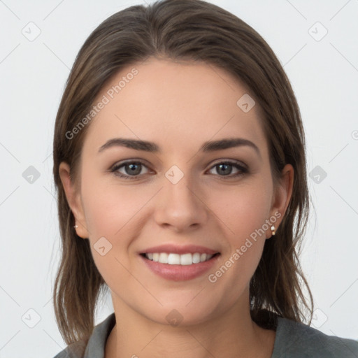 Joyful white young-adult female with long  brown hair and grey eyes