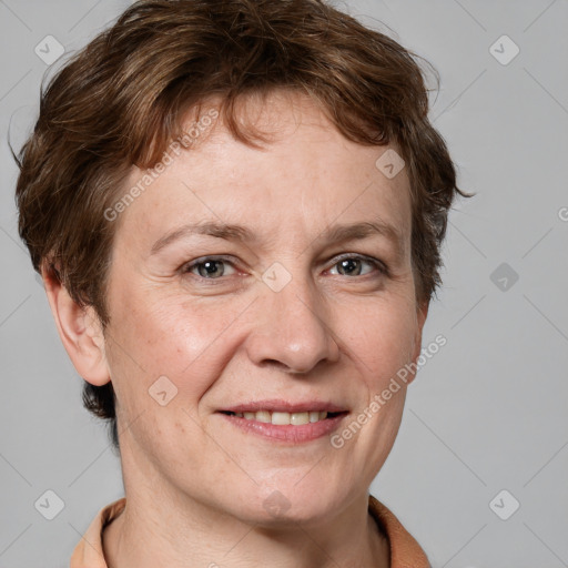 Joyful white adult female with short  brown hair and grey eyes