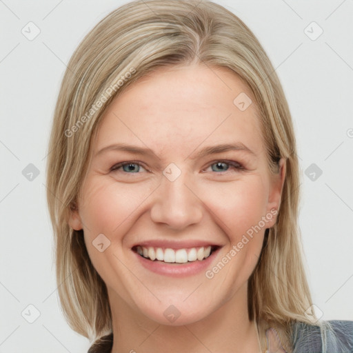 Joyful white young-adult female with medium  brown hair and blue eyes