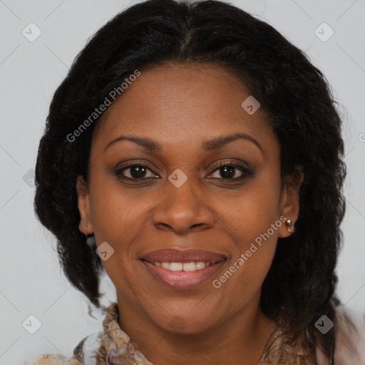 Joyful black adult female with medium  brown hair and brown eyes