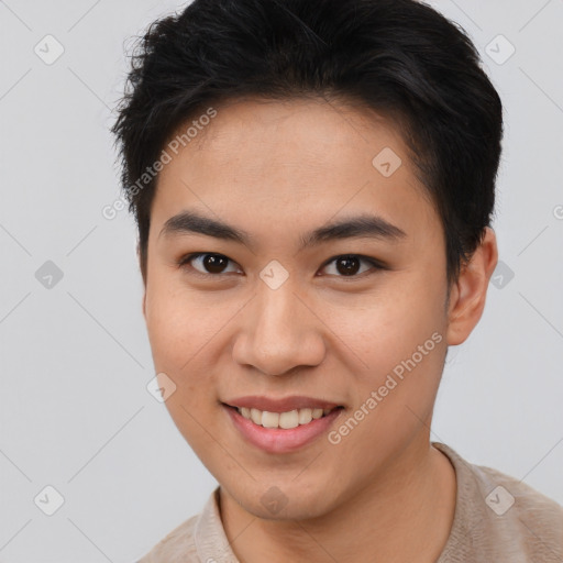 Joyful asian young-adult male with short  brown hair and brown eyes