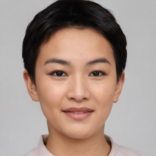 Joyful asian young-adult female with short  black hair and brown eyes