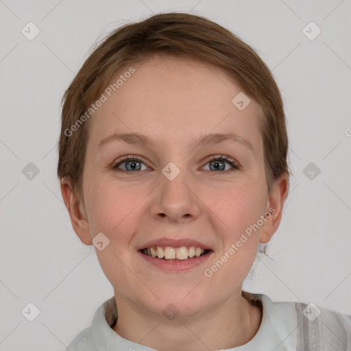 Joyful white young-adult female with short  brown hair and grey eyes