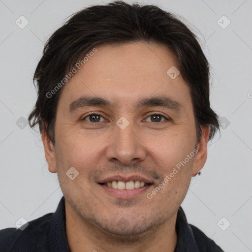 Joyful white adult male with short  brown hair and brown eyes