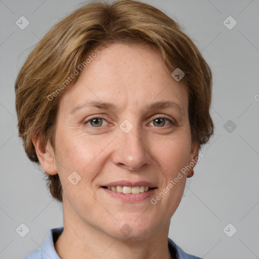 Joyful white adult female with medium  brown hair and grey eyes