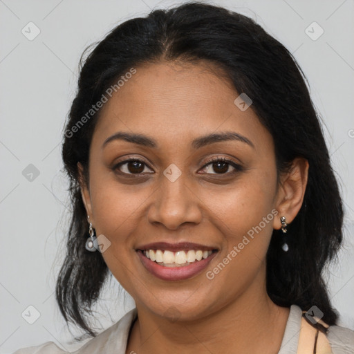 Joyful latino young-adult female with medium  brown hair and brown eyes