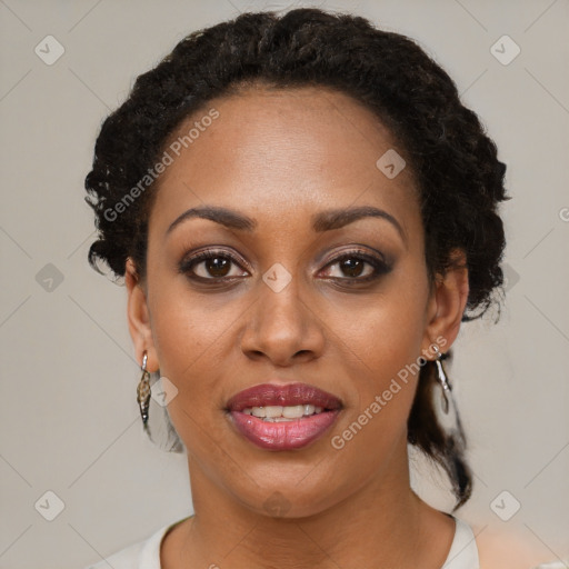 Joyful black young-adult female with short  brown hair and brown eyes