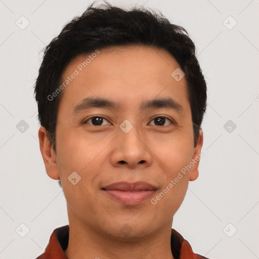 Joyful latino young-adult male with short  brown hair and brown eyes