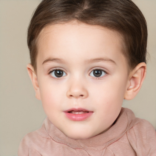 Joyful white child female with short  brown hair and brown eyes