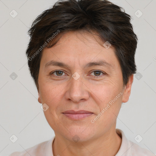 Joyful white adult female with short  brown hair and brown eyes