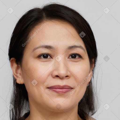 Joyful white adult female with medium  brown hair and brown eyes