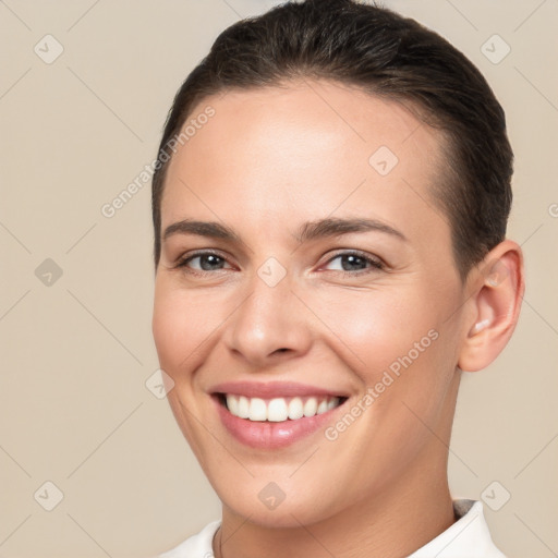 Joyful white young-adult female with short  brown hair and brown eyes