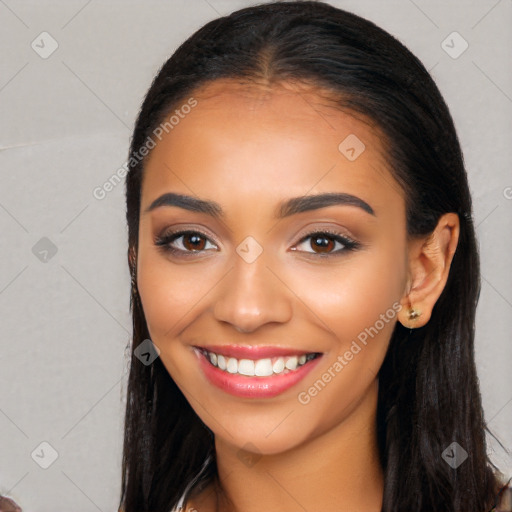 Joyful latino young-adult female with long  brown hair and brown eyes