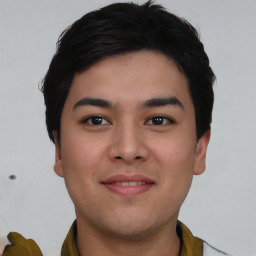 Joyful asian young-adult male with short  black hair and brown eyes