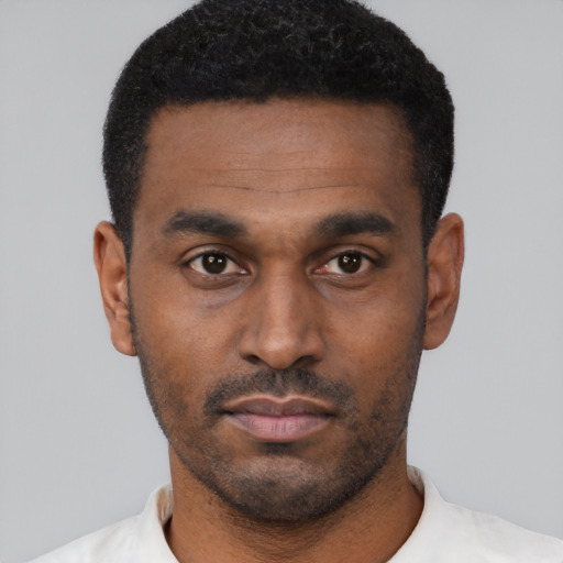Neutral black young-adult male with short  black hair and brown eyes