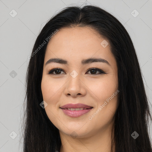 Joyful latino young-adult female with long  black hair and brown eyes