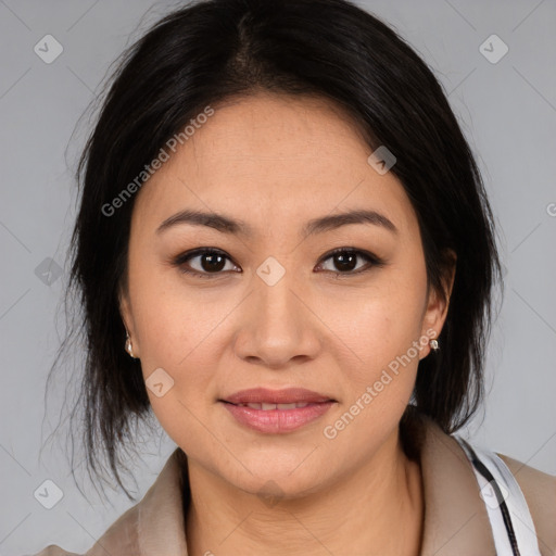 Joyful latino young-adult female with medium  brown hair and brown eyes