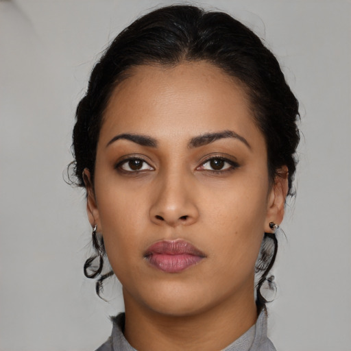 Neutral latino young-adult female with medium  brown hair and brown eyes