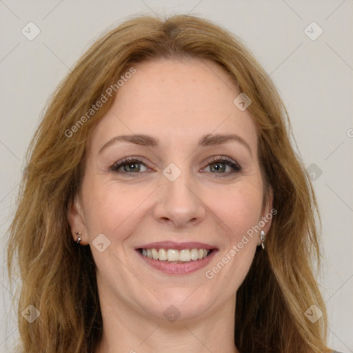 Joyful white young-adult female with long  brown hair and green eyes