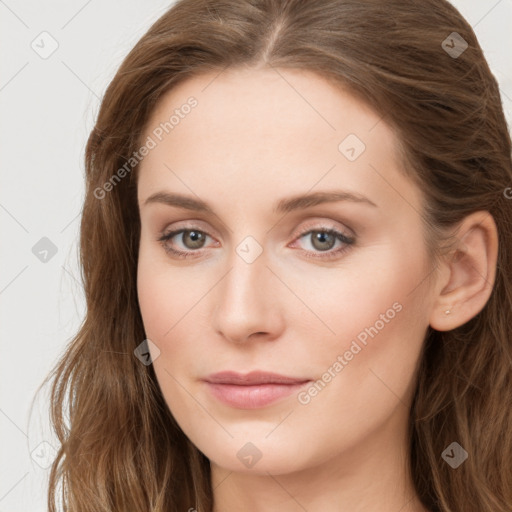 Joyful white young-adult female with long  brown hair and blue eyes