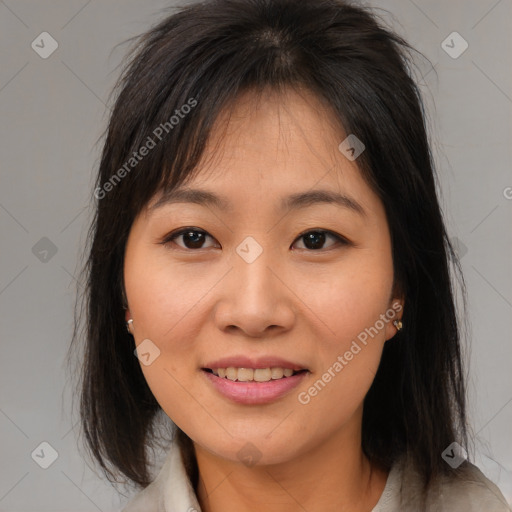 Joyful asian young-adult female with medium  brown hair and brown eyes