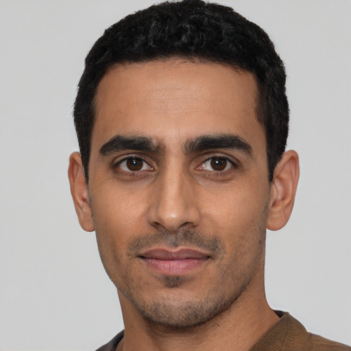 Neutral latino young-adult male with short  black hair and brown eyes