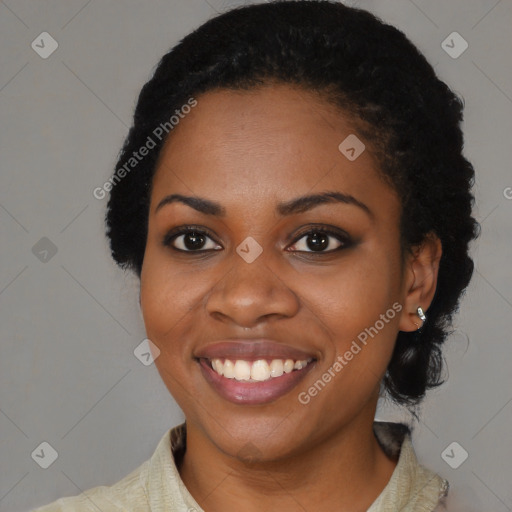 Joyful black young-adult female with medium  black hair and brown eyes