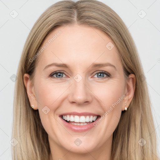 Joyful white adult female with long  brown hair and grey eyes